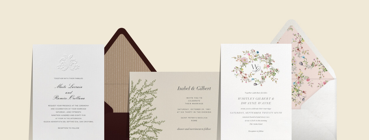 Three wedding invitations and two envelopes in varying styles. 1) formal style with floral embossed motif, 2) minimalist green forsythia illustration, 3) stylized monogram and delicate floral wreath.