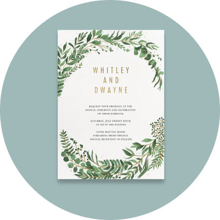 Wedding invitation with watercolor greenery boughs enveloping the text.