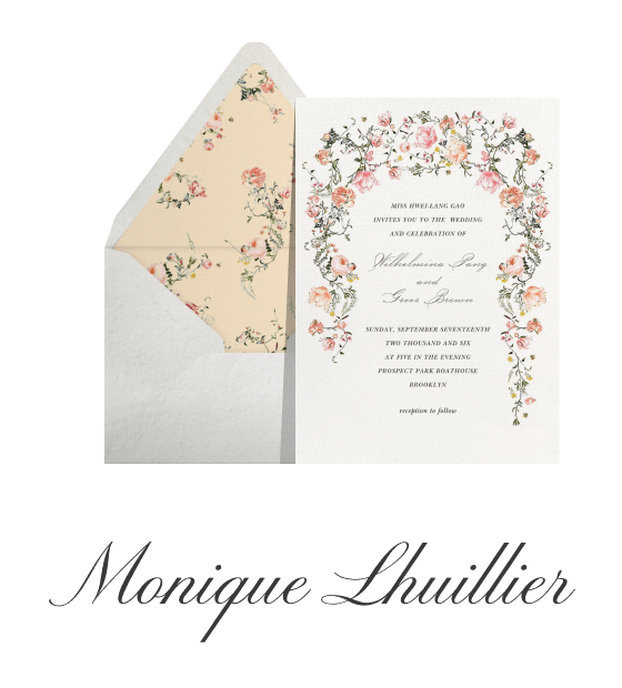 A floral Monique Lhuillier invitation with cascading pink and peach flowers, a coordinating envelope, and logo.