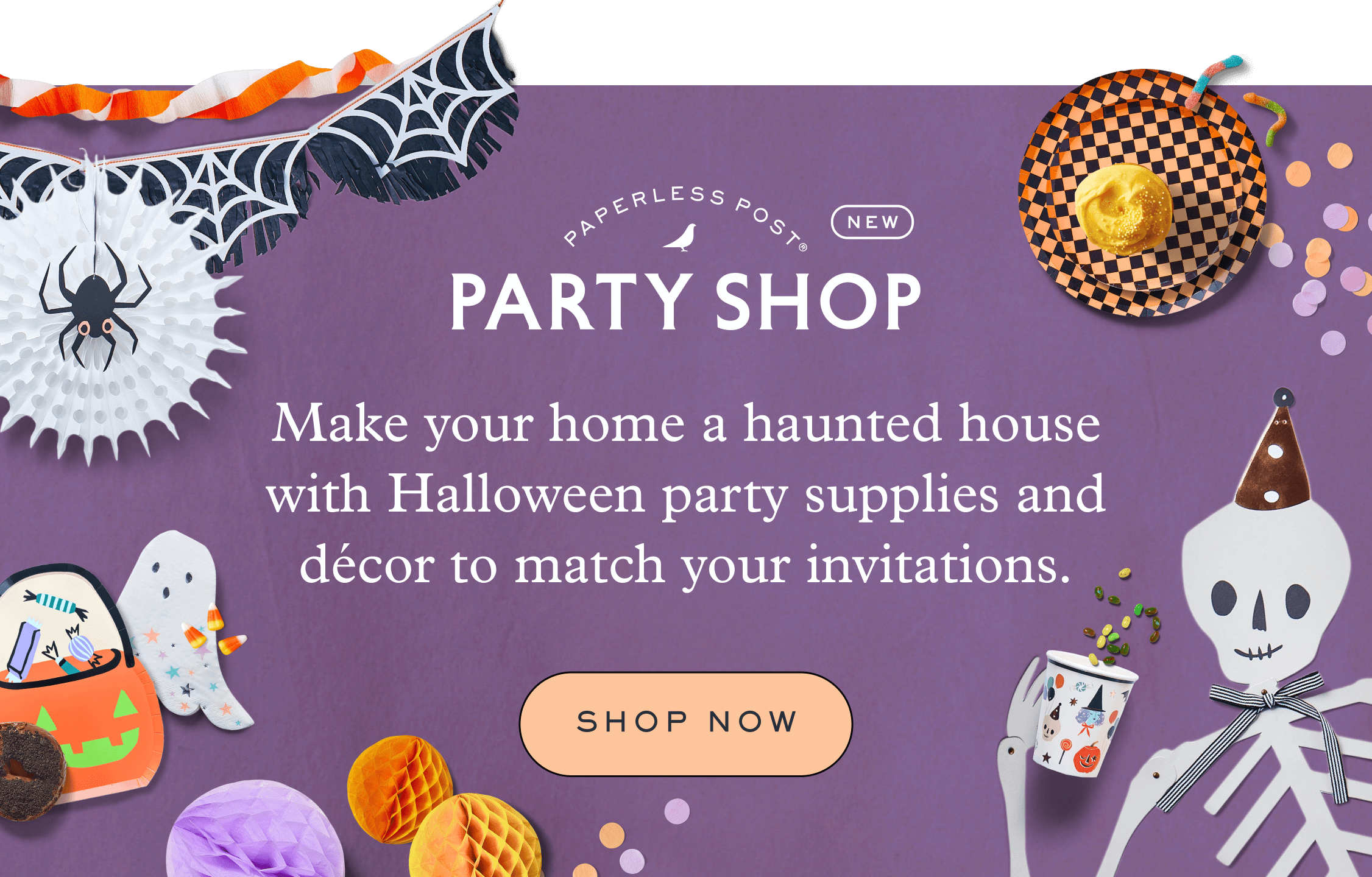 Spider web hanging banner and ghost, jack-o-lantern, black cat hanging banner next to a paper cutout of a skeleton with a party hat. Black honeycomb witch hat along side napkins and cups with the same design as the hanging banner and orange and black checkered plates on a purple background.